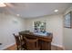 Cozy bar area featuring a dark wood bar with two chairs, recessed lighting, and window view at 62 Oakland Hills Pl, Rotonda West, FL 33947