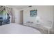 Bedroom features white accents, leading to the outdoor living area through patio doors at 62 Oakland Hills Pl, Rotonda West, FL 33947