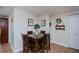 Cozy dining area featuring a wooden table with seating for four and tasteful decor at 62 Oakland Hills Pl, Rotonda West, FL 33947