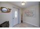 Inviting foyer with elegant tile flooring, and a stylish front door at 62 Oakland Hills Pl, Rotonda West, FL 33947