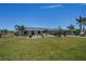 Well-maintained home with lush lawn and landscaping offering an inviting curb appeal for potential buyers at 62 Oakland Hills Pl, Rotonda West, FL 33947