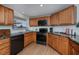 Updated kitchen with stainless steel appliances, wood cabinets, granite countertops and a window at 62 Oakland Hills Pl, Rotonda West, FL 33947