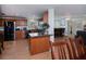 Stylish kitchen with stainless steel appliances, granite countertops and wooden cabinetry at 62 Oakland Hills Pl, Rotonda West, FL 33947