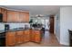 Updated kitchen with wood cabinets, granite counters, stainless steel appliances and a dining nook at 62 Oakland Hills Pl, Rotonda West, FL 33947