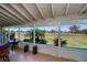 Lovely lanai with large windows and panoramic views of the lush green golf course at 62 Oakland Hills Pl, Rotonda West, FL 33947