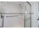 Accessible bathroom featuring a walk-in shower with grab bars at 62 Oakland Hills Pl, Rotonda West, FL 33947