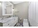 Neutral bathroom with a marble countertop vanity and a framed mirror at 6375 Coniston St, Port Charlotte, FL 33981