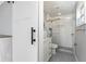 Bathroom showcasing a glass-enclosed shower, vanity, and hexagon tile flooring through a sliding barn door at 6375 Coniston St, Port Charlotte, FL 33981