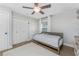 Bedroom with hardwood floors, neutral walls, a ceiling fan, and double closets for ample storage at 6375 Coniston St, Port Charlotte, FL 33981