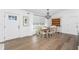 Cozy dining area with wood floors, traditional chandelier, and view to outside at 6375 Coniston St, Port Charlotte, FL 33981