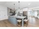 Modern kitchen with a central island, pendant lighting, stainless steel appliances, and sleek cabinetry at 6375 Coniston St, Port Charlotte, FL 33981