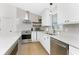 Well-designed kitchen with stainless steel appliances, white cabinets, and modern finishes at 6375 Coniston St, Port Charlotte, FL 33981