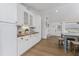 Bright kitchen featuring white cabinetry, butcher block countertops, and stainless steel appliances at 6375 Coniston St, Port Charlotte, FL 33981