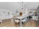 Open-concept kitchen and dining area with a view, a large island, and stainless steel appliances at 6375 Coniston St, Port Charlotte, FL 33981