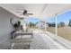 Outdoor lanai with seating, providing a relaxed space for enjoying the outdoors and views of the backyard at 6375 Coniston St, Port Charlotte, FL 33981