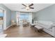 Inviting living room with comfortable seating, a ceiling fan, and natural light, perfect for relaxation and socializing at 6375 Coniston St, Port Charlotte, FL 33981