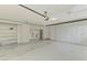 Spacious garage with ample storage, including cabinets, and laundry area at 7215 Brookhaven Ter, Englewood, FL 34224