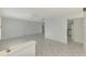 Spacious living room showcasing neutral tile flooring, a ceiling fan, and an open layout at 7215 Brookhaven Ter, Englewood, FL 34224