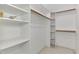 Walk-in closet with built-in shelving and ample storage space at 7215 Brookhaven Ter, Englewood, FL 34224