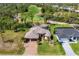 Aerial view of the home, golf course, and pond in the community at 758 Rotonda Cir, Rotonda West, FL 33947