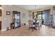 Dining room with modern chandelier, large glass doors, and stylish furniture at 758 Rotonda Cir, Rotonda West, FL 33947