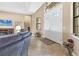 Welcoming foyer features neutral tones, tile floors, and ample natural light from double front doors at 758 Rotonda Cir, Rotonda West, FL 33947