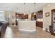 Open kitchen with breakfast bar, pendant lighting, and neutral color palette at 758 Rotonda Cir, Rotonda West, FL 33947