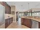Inviting kitchen features granite countertops, stainless appliances, and wood cabinetry at 758 Rotonda Cir, Rotonda West, FL 33947