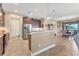 Spacious open-concept kitchen with a breakfast bar and stainless steel appliances at 758 Rotonda Cir, Rotonda West, FL 33947