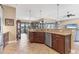 Kitchen with granite counters, stainless appliances, and an open view to the backyard at 758 Rotonda Cir, Rotonda West, FL 33947
