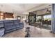 Bright and airy living space with sliding glass doors, modern furnishings, and easy access to the kitchen at 758 Rotonda Cir, Rotonda West, FL 33947