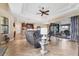 Spacious open-concept living area with tile flooring, comfortable seating, and access to the outdoor lanai at 758 Rotonda Cir, Rotonda West, FL 33947