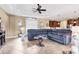 Expansive living area with cozy seating, tray ceilings, tile floors, and lots of natural light at 758 Rotonda Cir, Rotonda West, FL 33947