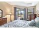 Comfortable main bedroom features a calming color palette and a scenic view at 758 Rotonda Cir, Rotonda West, FL 33947