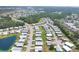 Wide aerial view of a Florida retirement community filled with cozy mobile homes and green spaces at 816 Tangerine Woods Blvd, Englewood, FL 34223