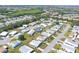 High aerial view of a Florida retirement community boasting cozy mobile homes and lush landscapes at 816 Tangerine Woods Blvd, Englewood, FL 34223