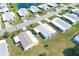 Aerial view of well-maintained homes in a tranquil community, each with lush lawns at 816 Tangerine Woods Blvd, Englewood, FL 34223