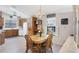The dining area is connected to the kitchen and features wood furniture at 816 Tangerine Woods Blvd, Englewood, FL 34223