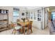 Cozy dining room with a table, four chairs, and decorative built-in shelving at 816 Tangerine Woods Blvd, Englewood, FL 34223