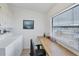 Well-lit laundry area complete with washer, dryer, overhead storage and workspace with a view at 816 Tangerine Woods Blvd, Englewood, FL 34223