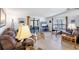 Inviting living room featuring neutral walls, modern flooring and comfortable seating arrangement at 816 Tangerine Woods Blvd, Englewood, FL 34223