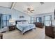Spacious main bedroom featuring a ceiling fan, natural light, and ensuite bathroom at 816 Tangerine Woods Blvd, Englewood, FL 34223