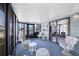 Spacious sunroom with comfortable seating, offering a seamless transition between indoor and outdoor living at 816 Tangerine Woods Blvd, Englewood, FL 34223