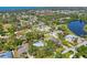 An aerial view of a home with a screened pool located in a community near a lake at 850 Van Gogh Road, Englewood, FL 34223