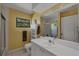 Bathroom with a large vanity, modern fixtures, and separate shower area at 850 Van Gogh Road, Englewood, FL 34223