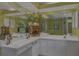 Bright bathroom features a large mirror, ample counter space, and plenty of natural light at 850 Van Gogh Road, Englewood, FL 34223