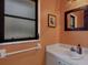 Bathroom featuring a sink with a framed mirror, a frosted window, and an updated faucet at 850 Van Gogh Road, Englewood, FL 34223
