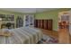 Spacious bedroom with backyard access, hardwood floors, and built-in storage at 850 Van Gogh Road, Englewood, FL 34223