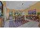 Inviting dining room featuring a stylish light fixture, artwork, and a cozy dining set at 850 Van Gogh Road, Englewood, FL 34223