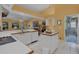 Large white kitchen features an island, breakfast bar and stainless appliances. Perfect for entertaining at 850 Van Gogh Road, Englewood, FL 34223